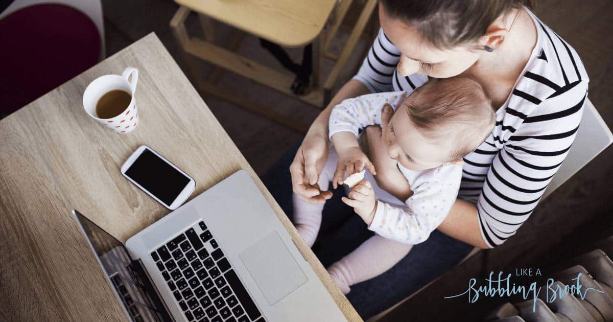 Mother working from home with baby