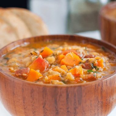 This Carrot and Lentil Soup recipe is packed full of flavor! Crispy bacon and a splash of white wine compliments the lentils and carrots, creating a hearty, filling soup that's an easy family favorite.