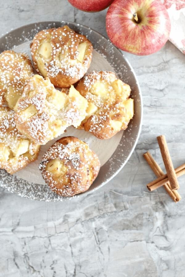 Apple fritter donuts recipe with fritters arranged in a serving tray