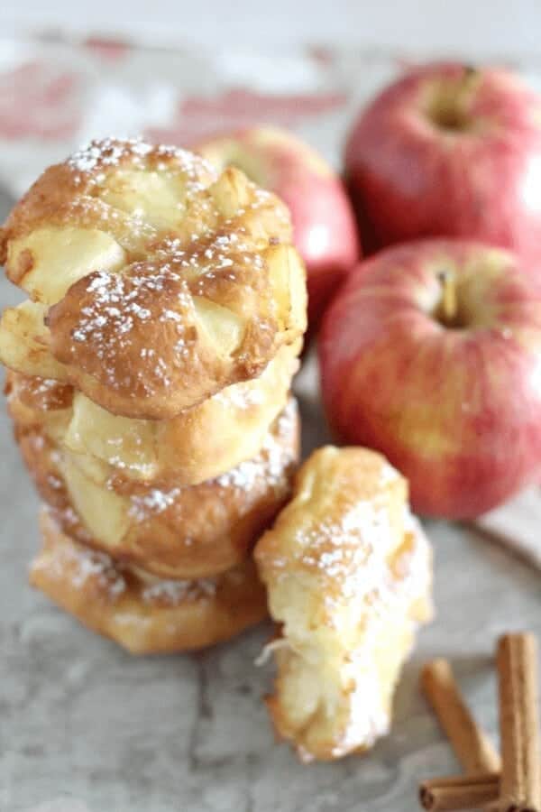 Apple fritter donuts recipe stacked on a plate