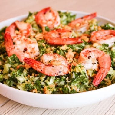 Shrimp kale salad in a low bowl