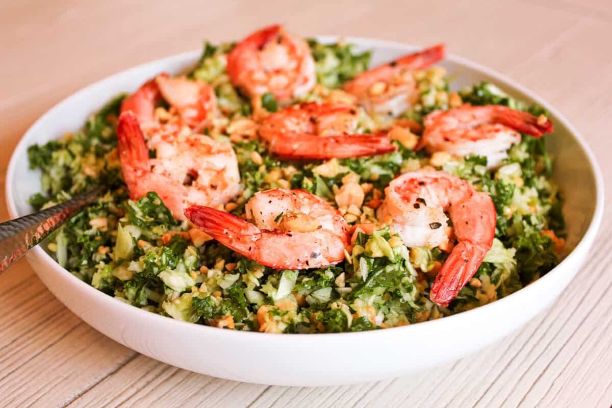 Shrimp kale salad in a low bowl