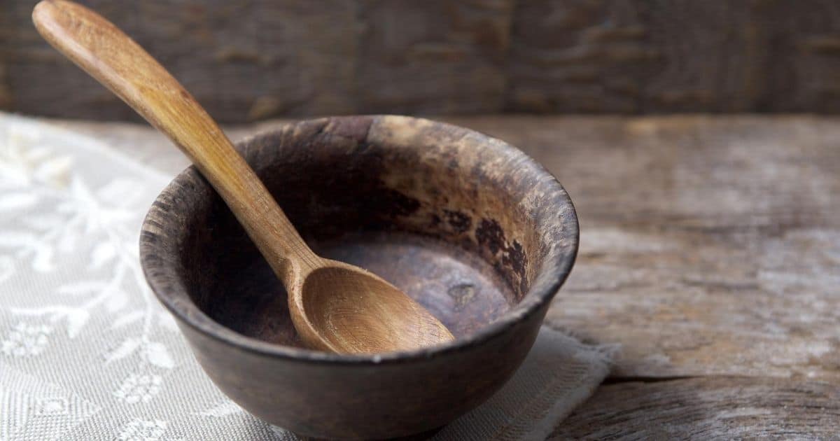 Empty wooden bowl and spoon