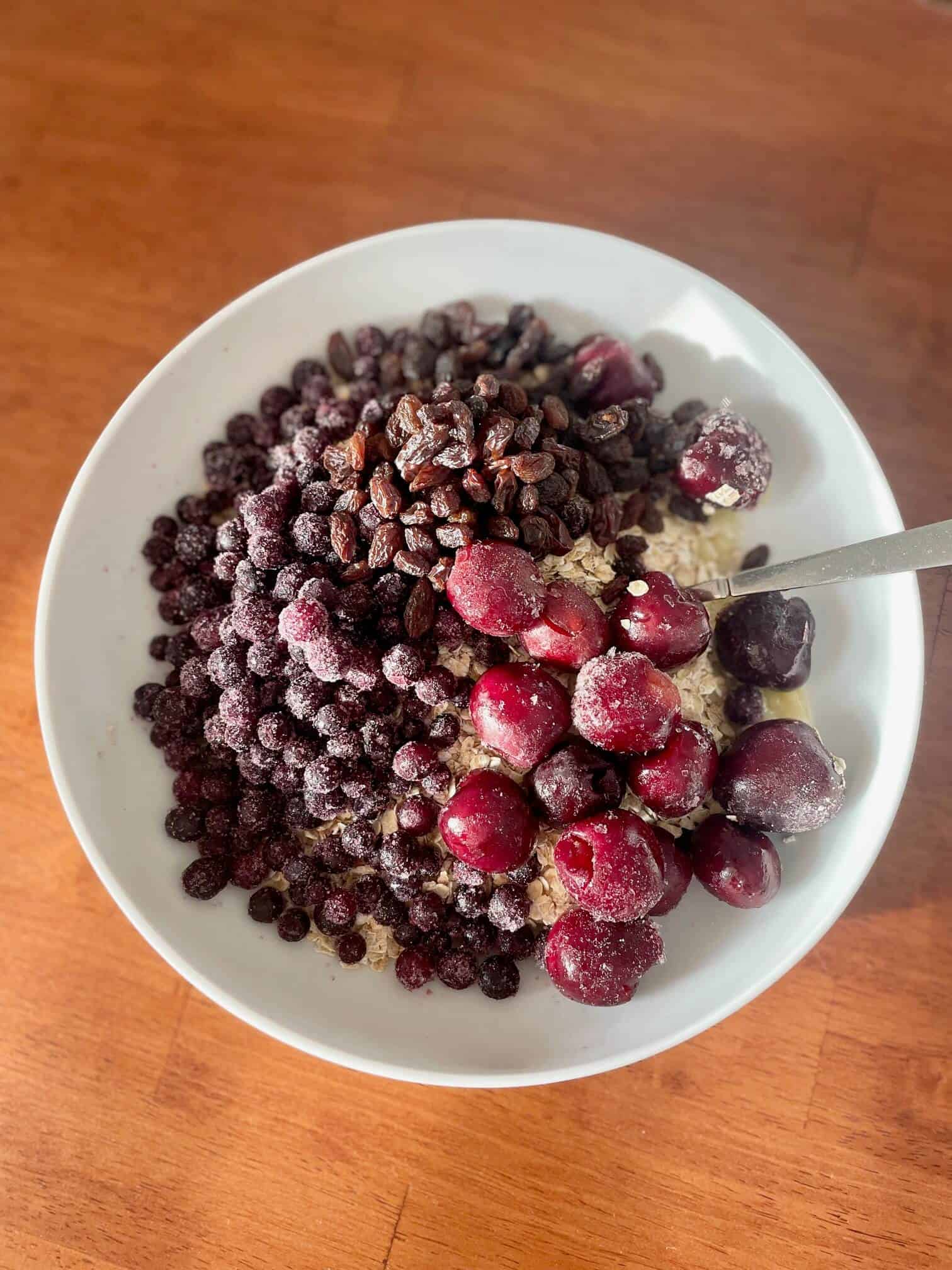 Berries thawing in bowl of oats - Daniel Fast breakfast idea